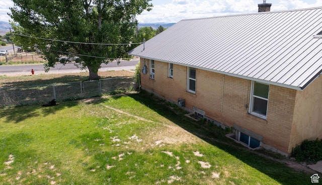 97 N 400 W, Aurora, UT 84620 - view of side of property featuring a chimney, brick siding, metal roof, and a standing seam roof