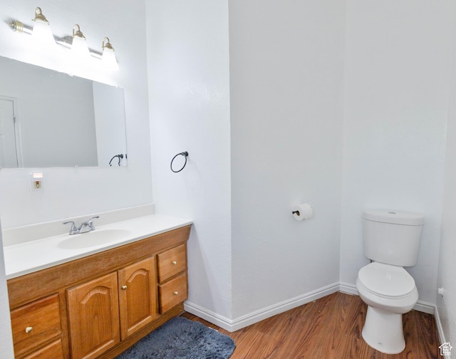 97 N 400 W, Aurora, UT 84620 - bathroom featuring wood finished floors, toilet, baseboards, and vanity