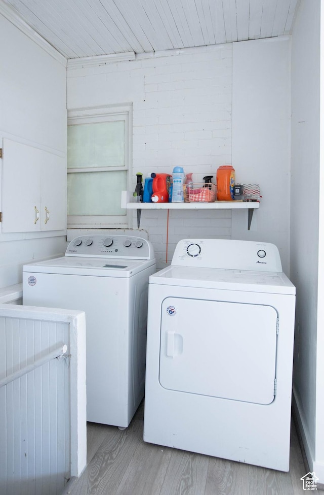 97 N 400 W, Aurora, UT 84620 - laundry room with separate washer and dryer, wood finished floors, and cabinet space