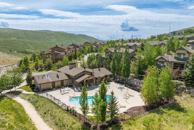 13597 N Hillclimb Ln, Kamas, UT 84036 - aerial view of residential area with a pool and a mountainous background