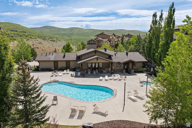 13597 N Hillclimb Ln, Kamas, UT 84036 - community pool with a patio and a mountain view
