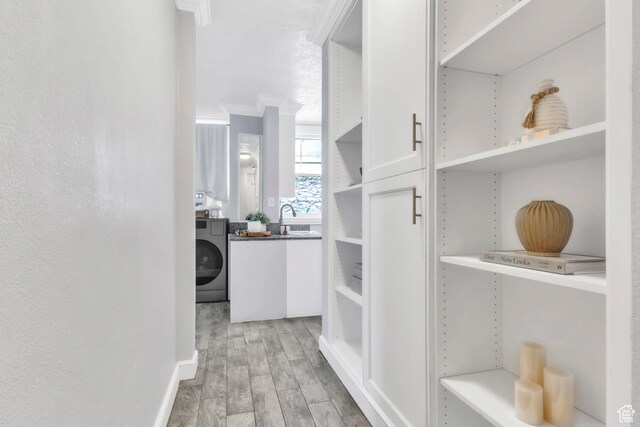 29 S State St Unit 216, Salt Lake City, UT 84111 - spacious closet with washer / dryer, light wood finished floors, and a sink