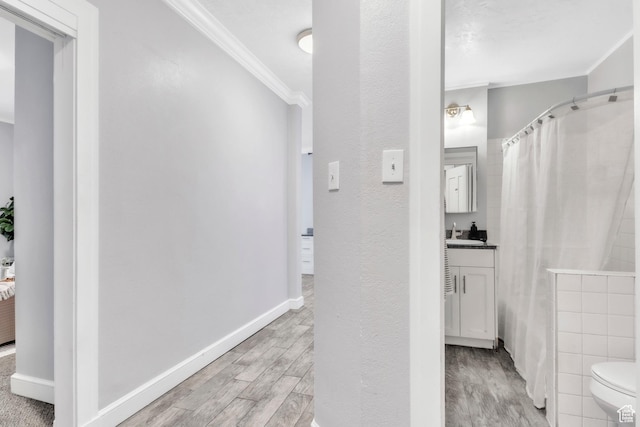 29 S State St Unit 216, Salt Lake City, UT 84111 - full bath with crown molding, wood finished floors, vanity, toilet, and a shower with shower curtain