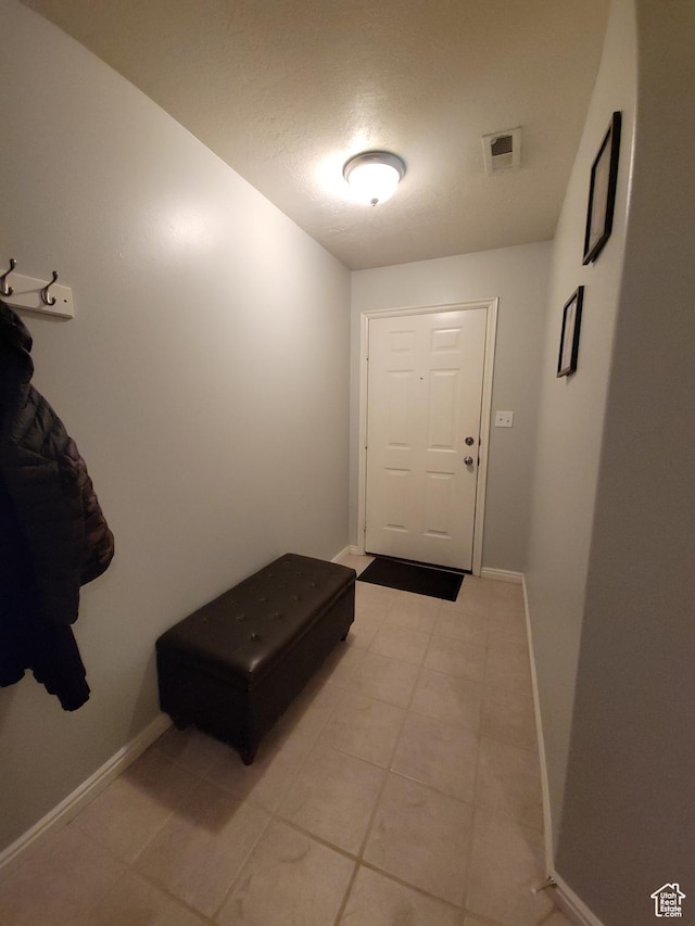 3878 W Sage Willow Dr, South Jordan, UT 84009 - doorway to outside with baseboards and light tile patterned floors