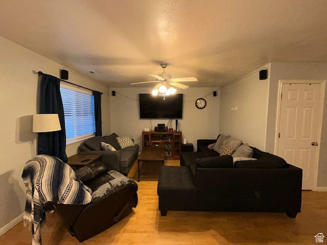 3878 W Sage Willow Dr, South Jordan, UT 84009 - living area with a ceiling fan, light wood-style floors, and baseboards