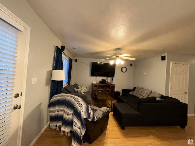3878 W Sage Willow Dr, South Jordan, UT 84009 - living area featuring a ceiling fan, light wood-type flooring, and baseboards