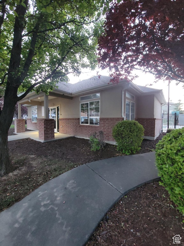 3878 W Sage Willow Dr, South Jordan, UT 84009 - view of front of home with brick siding and stucco siding