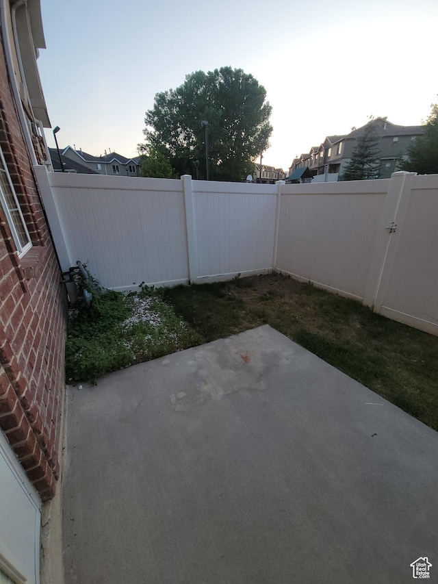 3878 W Sage Willow Dr, South Jordan, UT 84009 - fenced backyard with a patio area