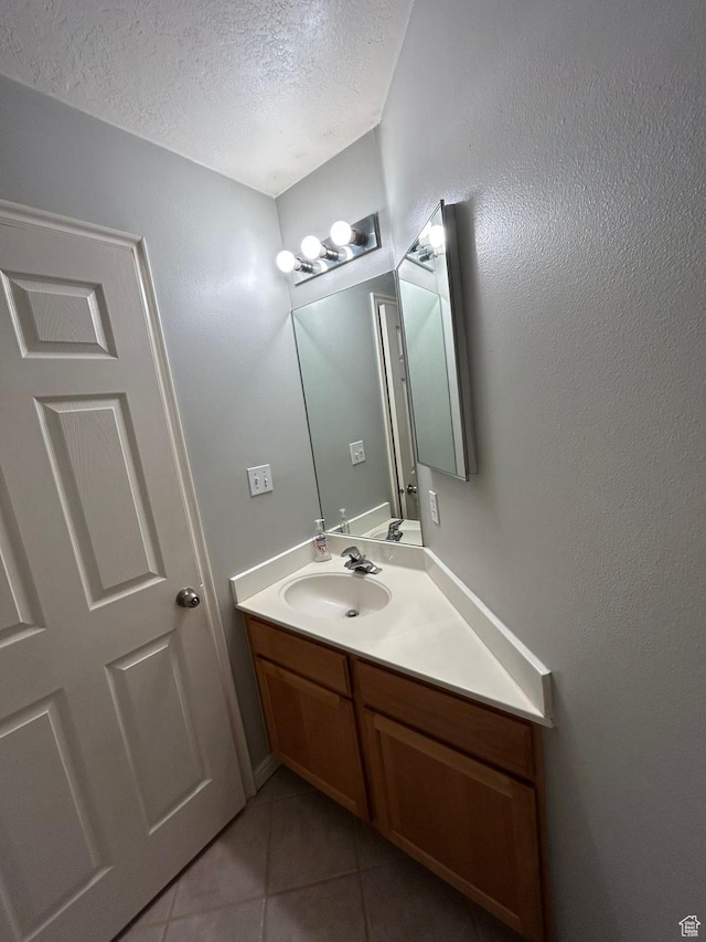 3878 W Sage Willow Dr, South Jordan, UT 84009 - bathroom with tile patterned flooring, a textured ceiling, and vanity