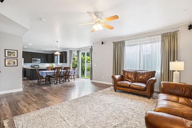 13326 S Rochdale Ln W, Herriman, UT 84096 - living area featuring dark wood-type flooring, a ceiling fan, and recessed lighting