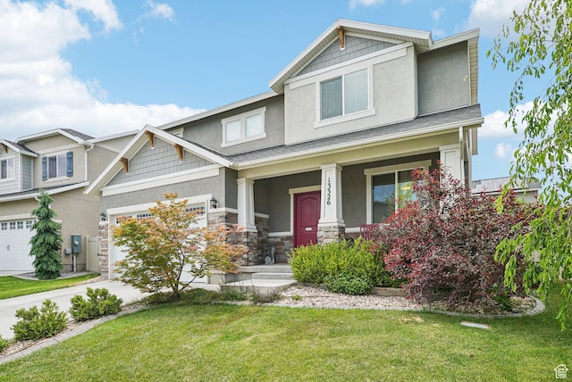 13326 S Rochdale Ln W, Herriman, UT 84096 - craftsman-style house with stucco siding, a porch, a front yard, and driveway