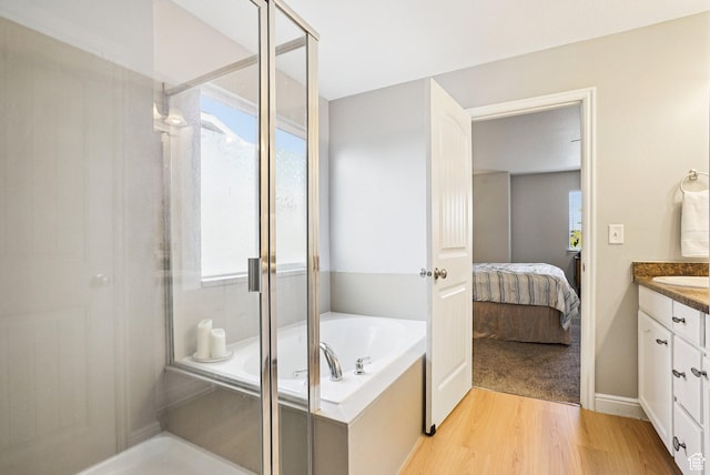 13326 S Rochdale Ln W, Herriman, UT 84096 - full bathroom with a stall shower, vanity, a garden tub, wood finished floors, and ensuite bath