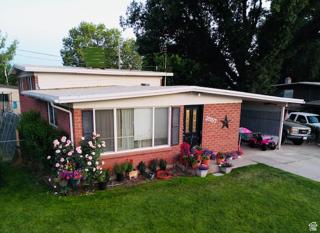 2557 W 5725 S, Roy, UT 84067 - view of front of property with brick siding and a front lawn