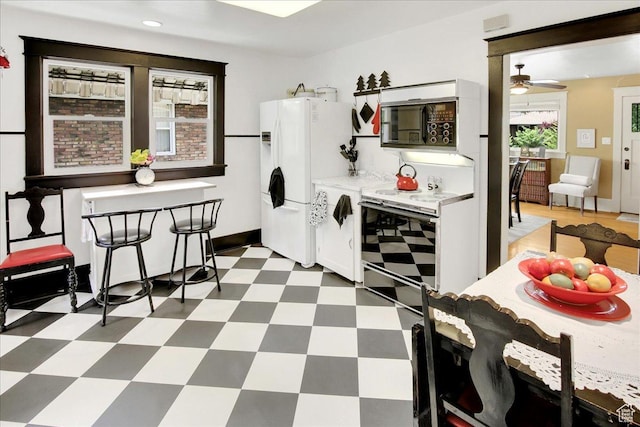 623 E Milton Ave, Salt Lake City, UT 84105 - kitchen featuring electric stove, light floors, light countertops, white fridge with ice dispenser, and a ceiling fan