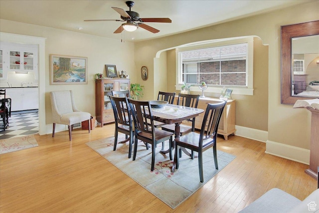 623 E Milton Ave, Salt Lake City, UT 84105 - dining space featuring light wood-style flooring, ceiling fan, arched walkways, and recessed lighting