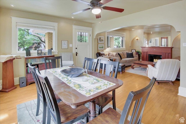 623 E Milton Ave, Salt Lake City, UT 84105 - dining area featuring arched walkways, light wood-style flooring, and ceiling fan