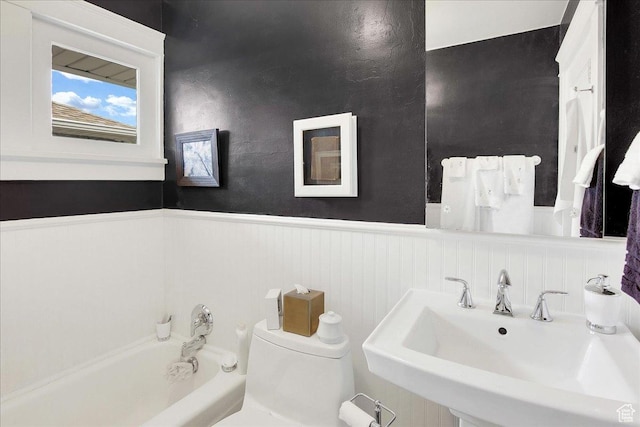 623 E Milton Ave, Salt Lake City, UT 84105 - full bathroom with a wainscoted wall and a bath