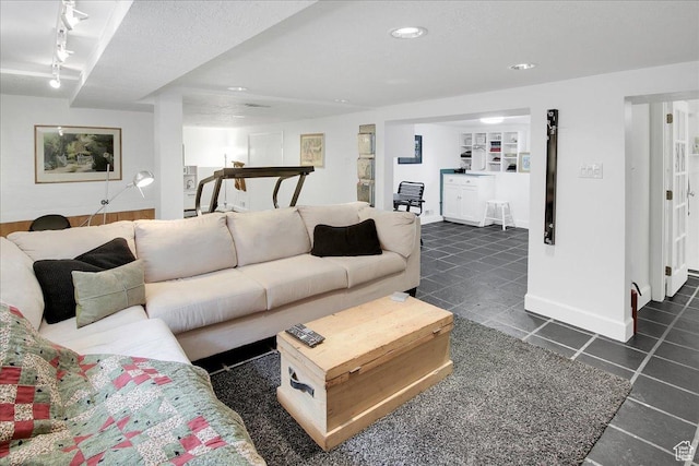 623 E Milton Ave, Salt Lake City, UT 84105 - living area with dark tile patterned flooring, track lighting, and recessed lighting