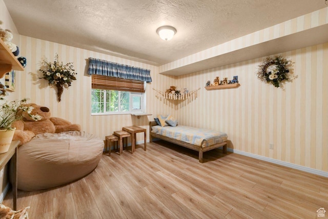 1262 W Dusty Downs Cir S, Jordan, UT 84095 - bedroom with wallpapered walls, wood finished floors, a textured ceiling, and baseboards