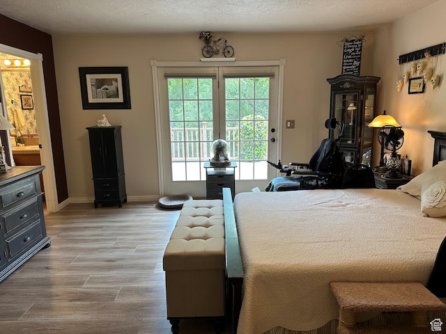 1262 W Dusty Downs Cir S, Jordan, UT 84095 - bedroom featuring access to outside, light wood-style flooring, and baseboards