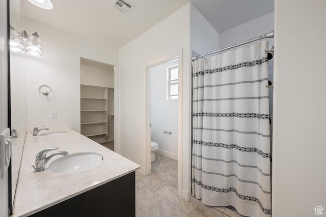 258 N Windsor Dr, Washington, UT 84780 - bathroom with double vanity and a shower with shower curtain
