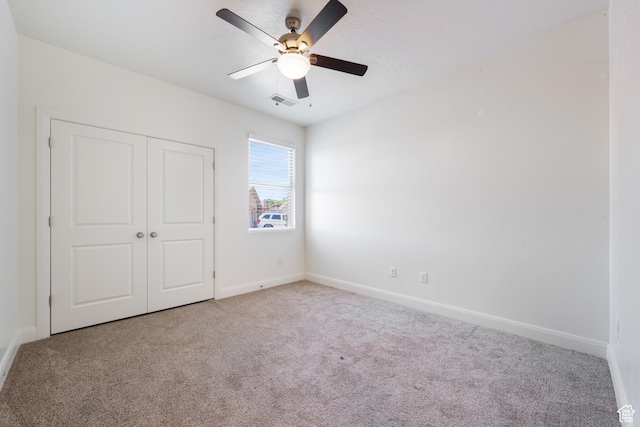 258 N Windsor Dr, Washington, UT 84780 - unfurnished bedroom with carpet, baseboards, a closet, and ceiling fan