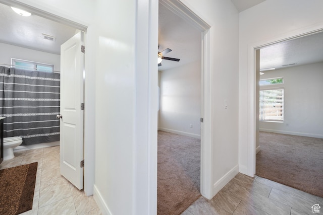 258 N Windsor Dr, Washington, UT 84780 - hallway featuring light carpet and baseboards