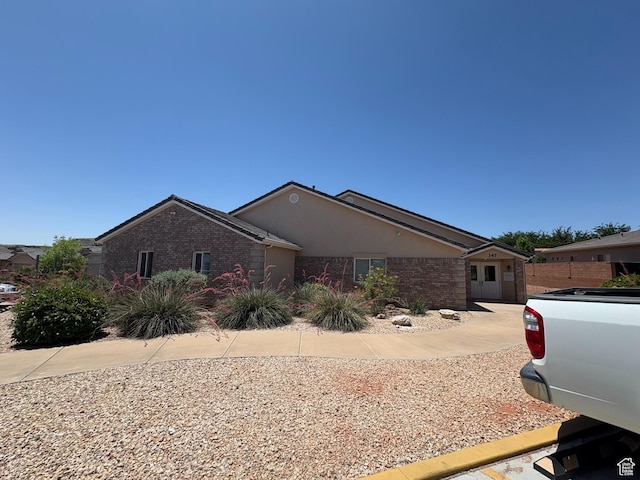 258 N Windsor Dr, Washington, UT 84780 - ranch-style home with stucco siding and brick siding