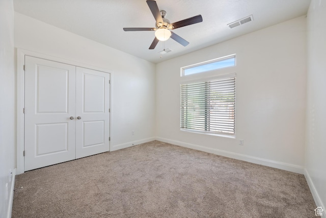 258 N Windsor Dr, Washington, UT 84780 - unfurnished bedroom featuring carpet, a closet, and a ceiling fan