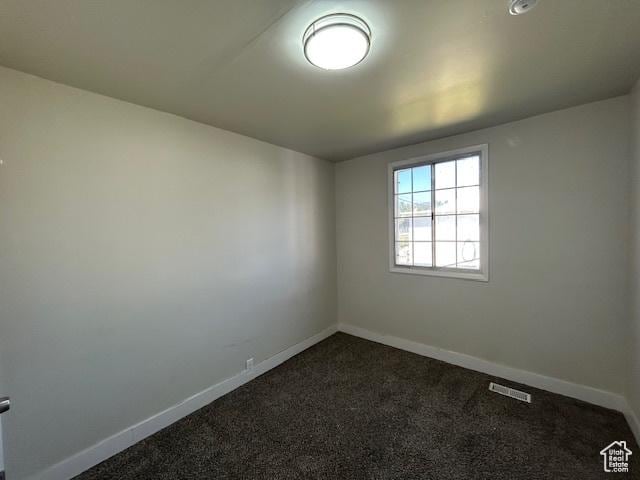 393 W 200 S, Tooele, UT 84074 - unfurnished room with dark carpet and baseboards