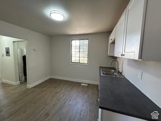 393 W 200 S, Tooele, UT 84074 - kitchen with a sink, white cabinetry, dark wood finished floors, and baseboards