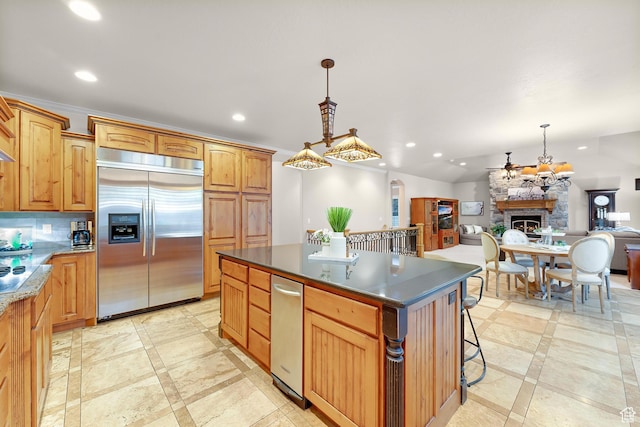 2221 E Fisher Ln S, Salt Lake City, UT 84109 - kitchen featuring built in fridge, inlaid floor details, a center island, a fireplace, and recessed lighting
