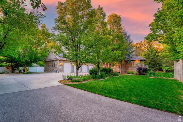 2221 E Fisher Ln S, Salt Lake City, UT 84109 - obstructed view of property featuring stone siding and driveway