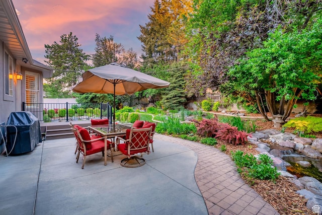 2221 E Fisher Ln S, Salt Lake City, UT 84109 - patio terrace at dusk featuring outdoor dining area, a patio, and area for grilling