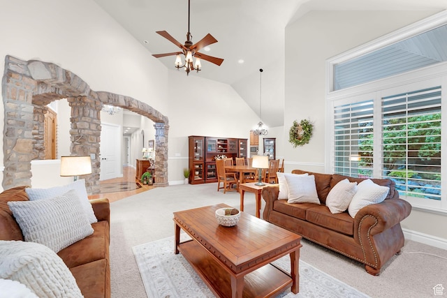 2221 E Fisher Ln S, Salt Lake City, UT 84109 - living area featuring decorative columns, light colored carpet, high vaulted ceiling, arched walkways, and ceiling fan