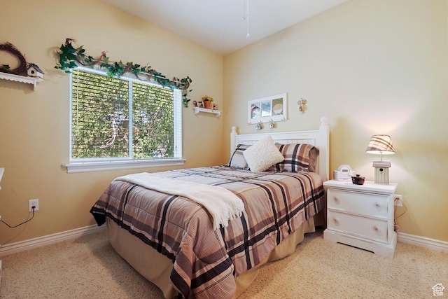 1174 E 3300 S Unit 417, Millcreek, UT 84106 - bedroom featuring baseboards and light colored carpet