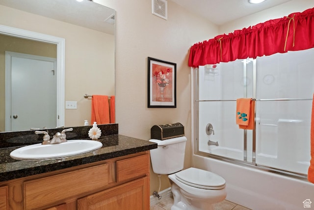 1174 E 3300 S Unit 417, Millcreek, UT 84106 - bathroom featuring toilet, tile patterned flooring, vanity, and combined bath / shower with glass door
