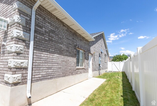 675 S 30 E, Ephraim, UT 84627 - view of side of property featuring brick siding, a gate, and a patio area
