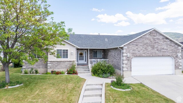 675 S 30 E, Ephraim, UT 84627 - ranch-style house featuring a garage, covered porch, brick siding, and driveway