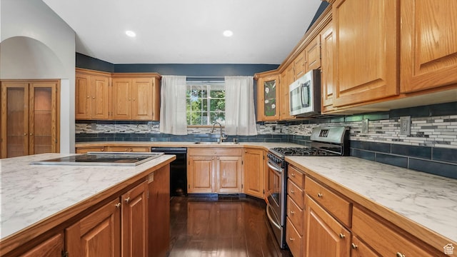 1580 E 1630 N, North Logan, UT 84341 - kitchen with stainless steel appliances, dark wood-type flooring, light countertops, decorative backsplash, and a sink
