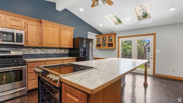 1580 E 1630 N, North Logan, UT 84341 - kitchen featuring stainless steel appliances, a skylight, light countertops, tasteful backsplash, and dark wood-style flooring