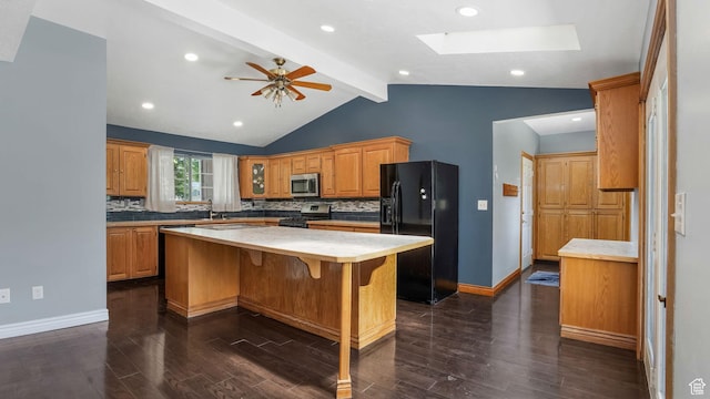 1580 E 1630 N, North Logan, UT 84341 - kitchen featuring appliances with stainless steel finishes, dark wood-style floors, decorative backsplash, a center island, and baseboards