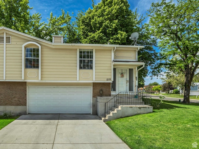 1219 W Middlesex Rd, Taylorsville, UT 84123 - view of front of home with brick siding, a front lawn, driveway, an attached garage, and a chimney