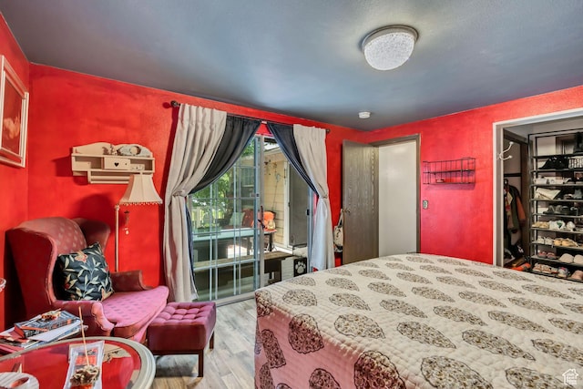 1219 W Middlesex Rd, Taylorsville, UT 84123 - bedroom with wood finished floors and access to outside
