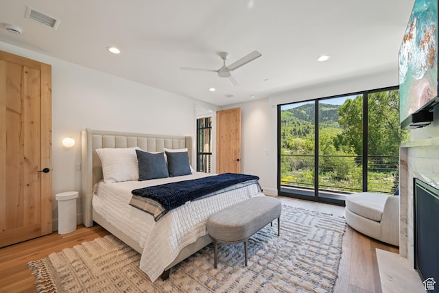 1990 Stone Creek Rd Unit 20, Park City, UT 84098 - bedroom featuring light wood-style flooring, access to outside, a high end fireplace, a ceiling fan, and recessed lighting