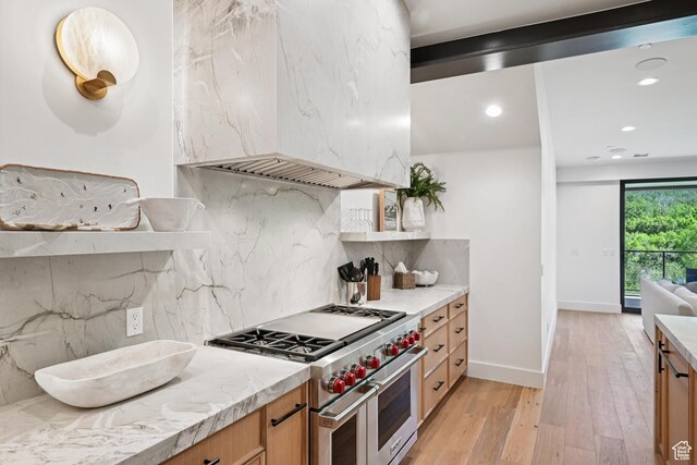 1990 Stone Creek Rd Unit 20, Park City, UT 84098 - kitchen with range with two ovens, light wood-type flooring, backsplash, light countertops, and recessed lighting
