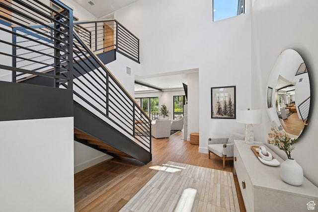 1990 Stone Creek Rd Unit 20, Park City, UT 84098 - staircase featuring wood finished floors and a towering ceiling