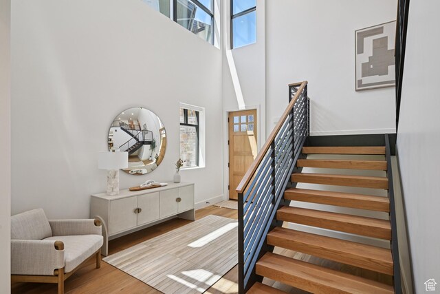 1990 Stone Creek Rd Unit 20, Park City, UT 84098 - stairway featuring plenty of natural light, a towering ceiling, and wood finished floors