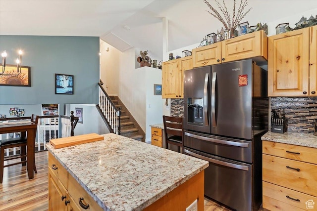 298 W 1775 N, Harrisville, UT 84414 - kitchen with stainless steel fridge with ice dispenser, decorative backsplash, a center island, light brown cabinets, and light stone counters