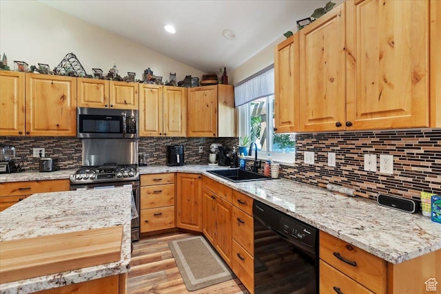 298 W 1775 N, Harrisville, UT 84414 - kitchen featuring black dishwasher, a sink, light wood finished floors, stainless steel range with gas cooktop, and vaulted ceiling